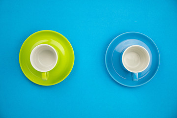 Colorful coffee cup on blue paper background