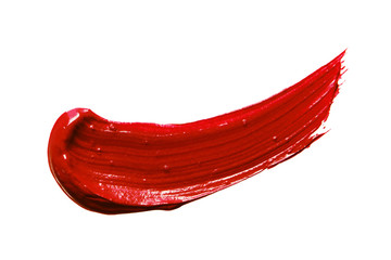 Lipstick smear smudge swatch isolated on white background. Cream makeup texture. Bright red color...