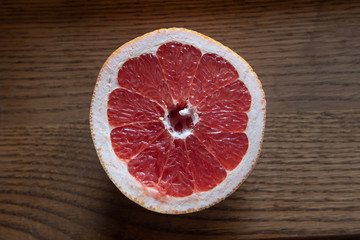 Red grapefruit on a wooden table