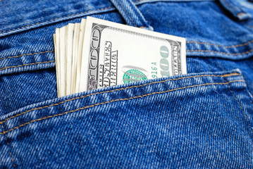dollars in pocket of jeans