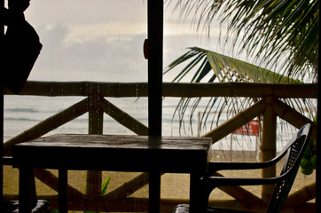 Balcony with table and chairs on the beach in Ayampe, Ecuador