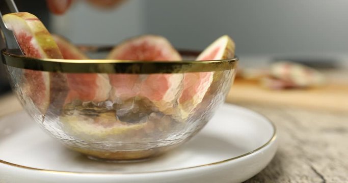 Making fig compote yogurt in glass bowl