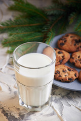 milk and cookies for Santa. holidays, celebration and home concept