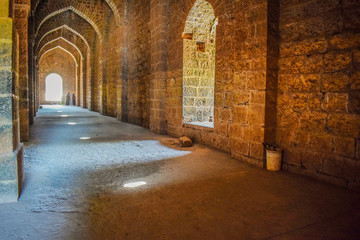 Picture of Ancient epic haunted fort in India in the bright afternoon depicting main door and windows