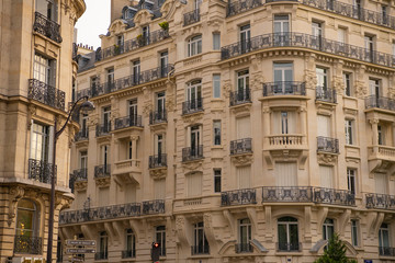 Fototapeta na wymiar Eiffel tower between Parisian tenement old street alley and buildings
