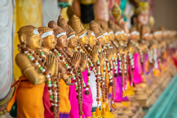 Sri Mahamariamman Temple golden statues with colorful fabric in Kuala Lumpur