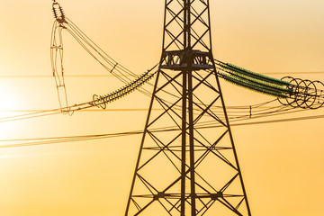 High voltage power line at sunset.