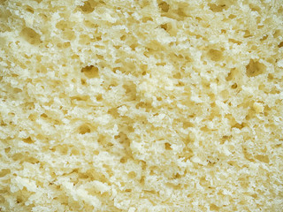 texture of yellow corn bread cutaway closeup - food background