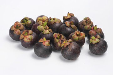 Mangosteens on white background, Pile of mangosteens