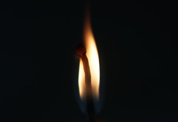 burning matches on a black background