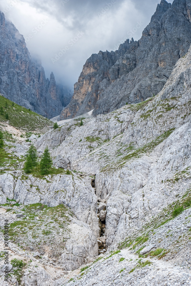 Wall mural Mountain canyon in a wild rocky alp landscape