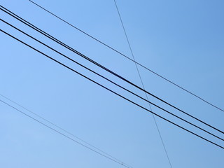 silhouette electric wire on blue sky background