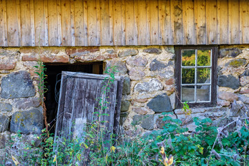 Old abandoned house with a broken door