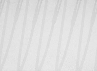 abstract shadow of fence on white wall background