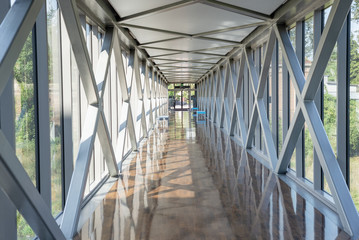 Modern steel glass corridor business building interior with natural landscape view