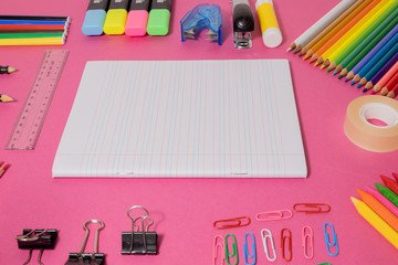 School supplies on yellow board background. Education, back to school concept with copy space