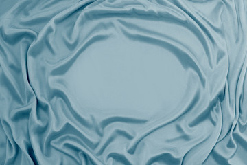 Photograph of silk fabric, color blue. The texture of silk fabric. Luxury silk fabric background...