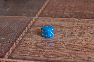 Blue dice on table.Social game