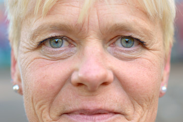Close-up portrait of a serene senior woman smiling