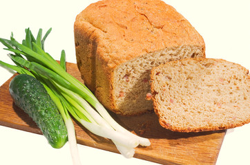 bread and vegetables on a white background