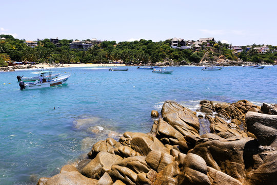 boats on shore of the sea