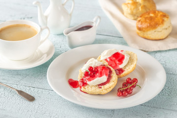 Obraz na płótnie Canvas Classic scones with cream and berry jam
