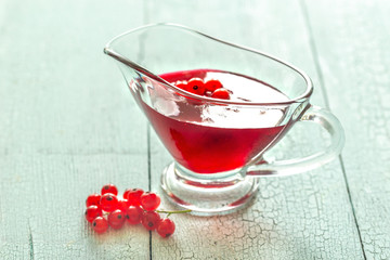 Glass boat of red currant jam