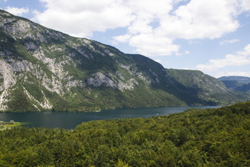 Naklejka na ściany i meble View from above of Lake Bohinj and surrounding mountains, from sky lift and Mount Vogel