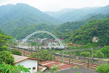 New Taipei City , Taiwan - July 28 , 2019 : Jieshou bridge cross the Keelung River.