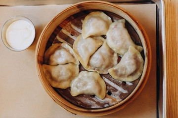 Dumplings, filled with cherry. Varenyky, vareniki, pierogi, pyrohy - dumplings with filling. View from above, top view
