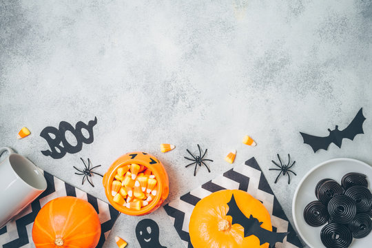 Halloween holiday background with pumpkin and candy corn .Top view from above. Flat lay
