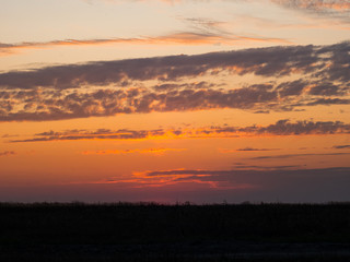 Beautiful Natural Sunset Sunrise Over Field. Landscape Colorful Sky