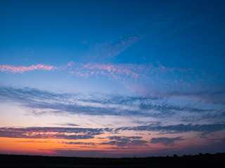 Beautiful Natural Sunset Sunrise Over Field. Landscape Colorful Sky