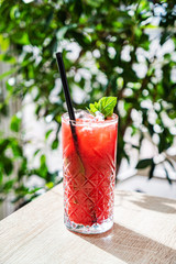 summer cocktail with strawberries and mint