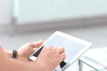 close up. digital tablet in the hands of a businessman