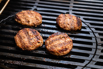 chef making grilled cutlets for burgers