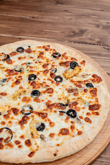 Pizza with Mozzarella cheese, chicken, olives, Spices . Italian pizza