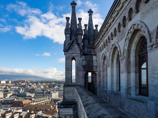 Fototapeta na wymiar Switzerland, february 2018: Panorama of the Old City of Geneva with Lake Geneva and the fountain Jet D'eau from Cathedral of Saint-Pierre, Geneva.