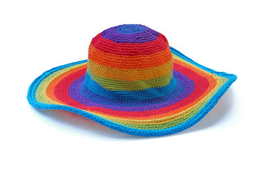 Colorful rainbow rope yarn hat isolated on a white background. Homemade knitted product.