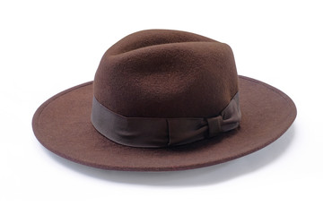 Vintage brown hat fasion with white ribbon isolated on white background. This has clipping path