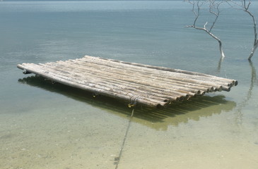 Bamboo raft is floating in the lagoon 