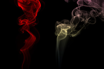 Obraz premium fire of colorful smoke on black background, darkness concept