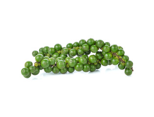 green peppercorns on white background