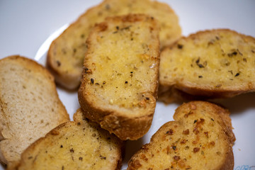 homemade garlic bread in white plate, Sensitive Focus