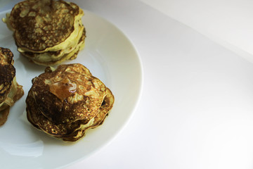 Pancakes on a white plate