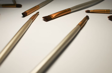 Makeup brushes on pink background