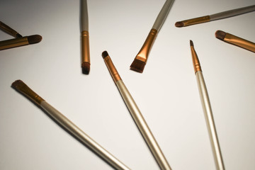 Makeup brushes on pink background