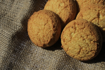 Cookies and a glass of yogurt on a piece of cloth