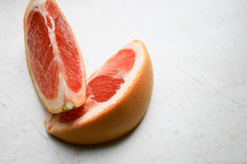 Sliced grapefruit on a stone table