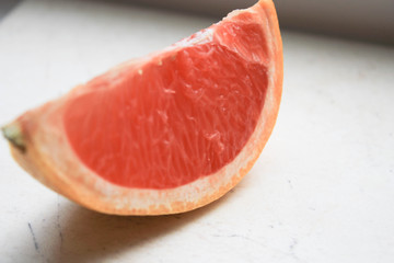 Sliced grapefruit on a stone table